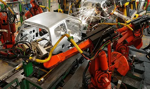 A car being worked on in an assembly line.